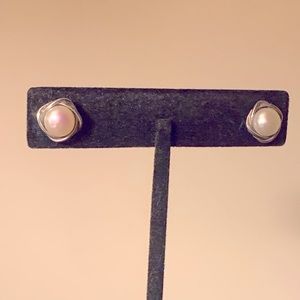 White fresh water pearl earrings bezel set in sterling silver. By Honora.